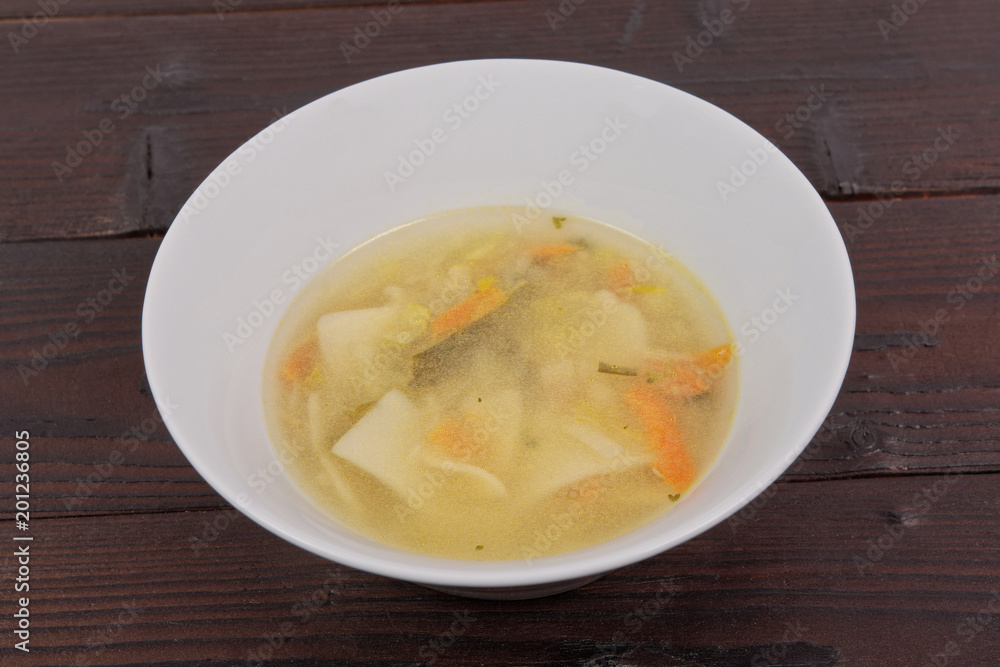 Noodle soup with vegetables on a table Noodle soup with vegetables on a table