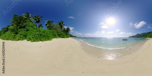 360 degree view 4k video beautiful natural sand beach with calm lagoon on seychelles island on sunny vacation day, recorded in 8K
