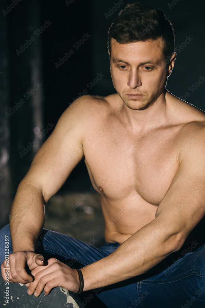 Fototapeta premium Close up of a young athlete concentrating before a workout