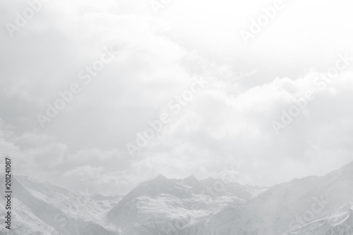 Snow cloud mountain landscape. Snow-capped peaks in the fog © Bakulov