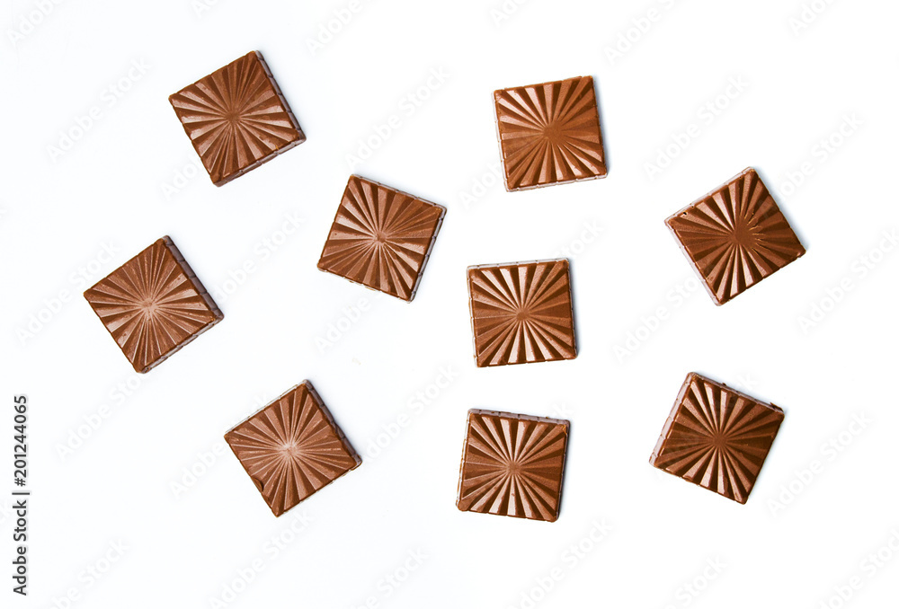Chocolate pieces isolated on white background Chocolate pieces isolated on white background