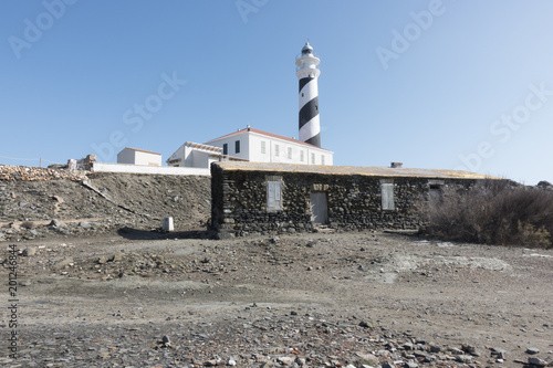 Lighthouse on the slate cape of Favaritx, Menorca, Balearic Islands, Spain