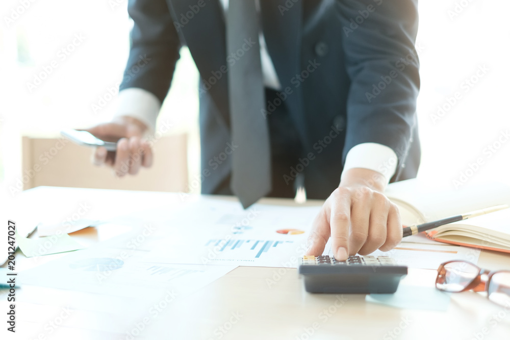 calculate of finance with business man using calculator to analysis data of financial. calculate of finance with business man using calculator to analysis data of financial.