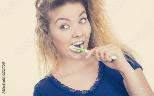 Woman brushing cleaning teeth