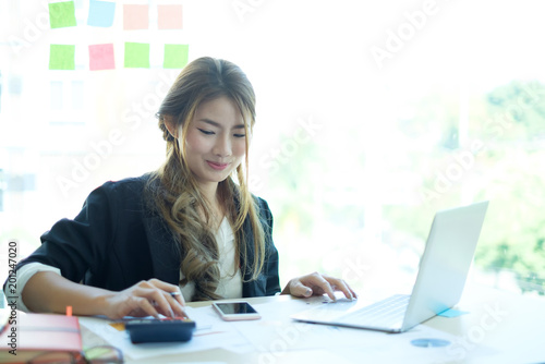 Asian woman working with business job smile and fun feeling.