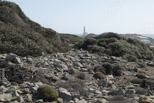 Lighthouse on the slate cape of Favaritx, Menorca, Balearic Islands, Spain