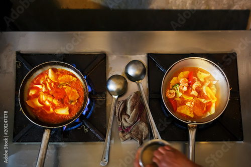 Chicken curry on black stone background with copy space. Top view, flat lay photo