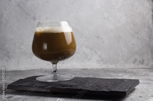 coffee beverage in a glass stone background