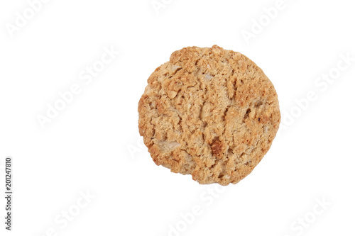 One healthy vegan integral cookie made from hazelnut powder   linseed isolated on white background. Single home made vegetarian sugarless   gluten free snack with nuts. Close up  copy space  top view.