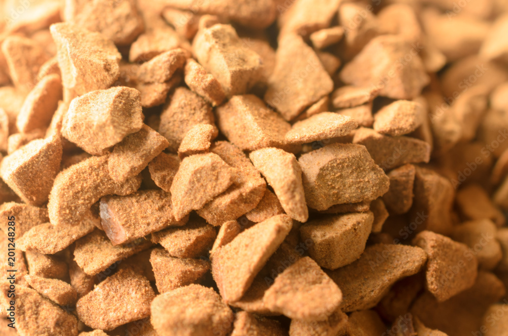 Granules of instant coffee in macro as background. Granules of instant coffee in macro as background.