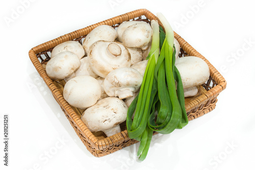 Fresh champignons with green onions