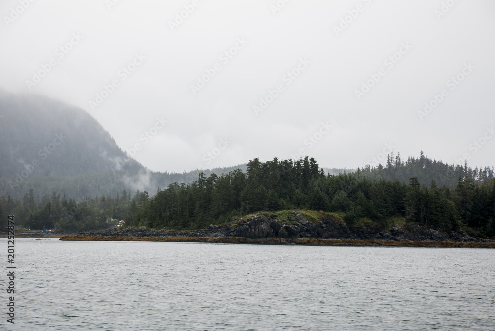 Alaska USA - Cruising in Auke Bay in a cloudy day Alaska USA - Cruising in Auke Bay in a cloudy day