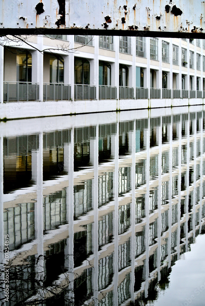 reflection of a modern building in the London canal,
