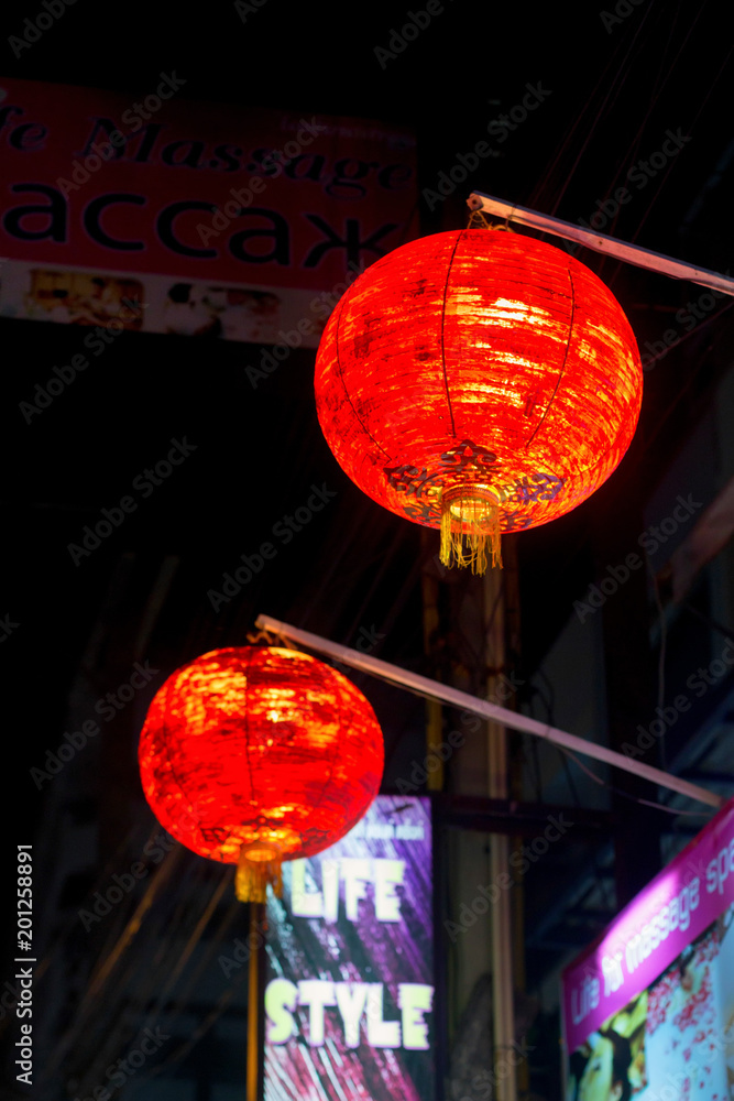 Red Chinese lanterns in evening street