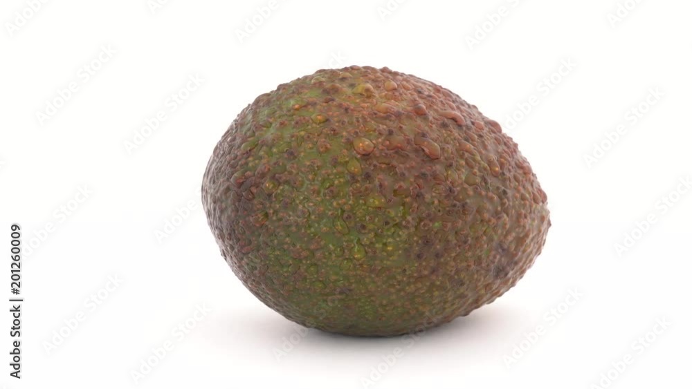 Green avocado rotates on a turn table. Isolated on white. Close-up macro. Loopable, Green avocado rotates on a turn table. Isolated on white. Close-up macro. Loopable,