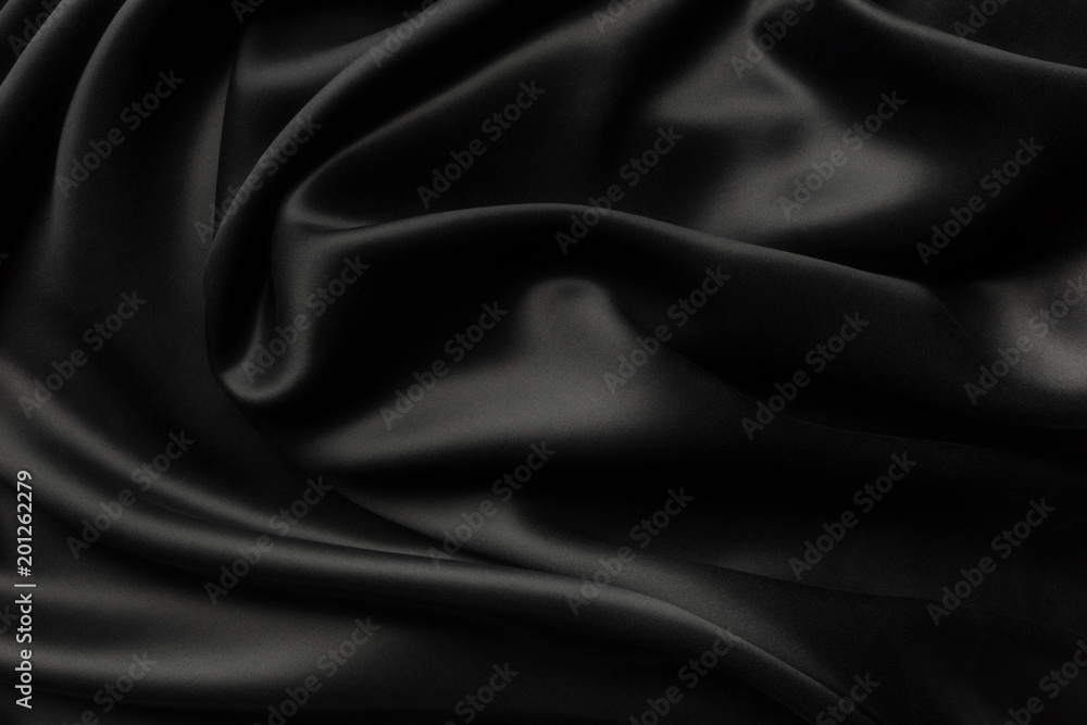 Elegant black satin silk with waves, abstract background. Elegant black satin silk with waves, abstract background.