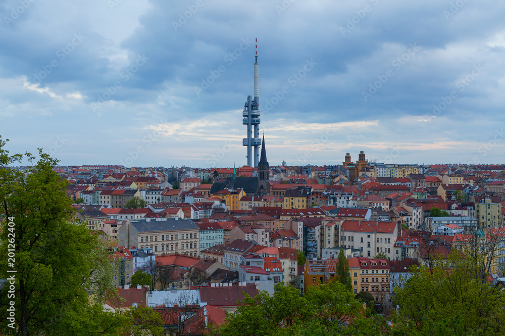 Zizkov Television Tower (circa 1992) in Prague and roof top view of dwellings around tower.