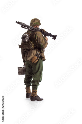 Murais de parede Man actor in the movie role of an old military man  with a MG 42 machine gun pos
