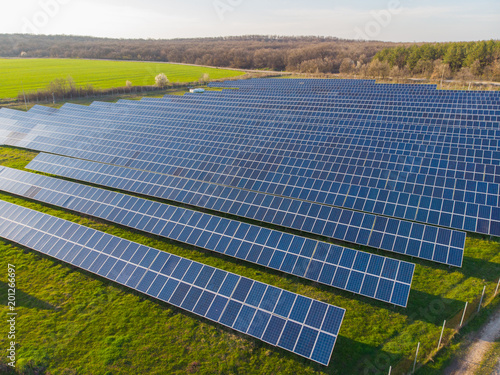 Aerial view industrial Photovoltaic solar units panels environment producing renewable green energy