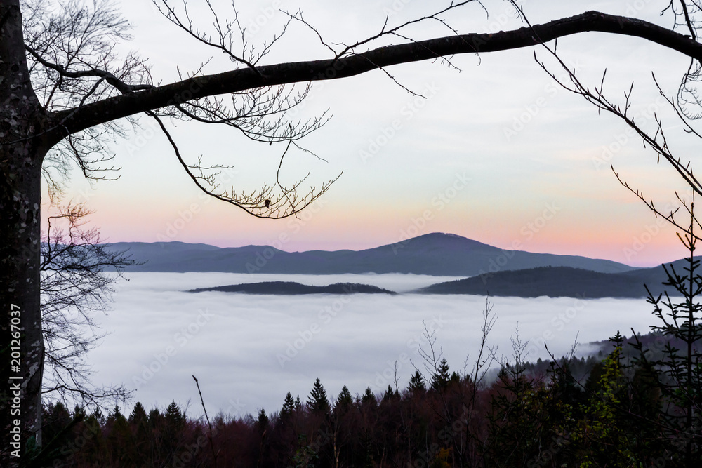 Sunset Over A Mountain Overlooking A Blanket Of Fog Downstream