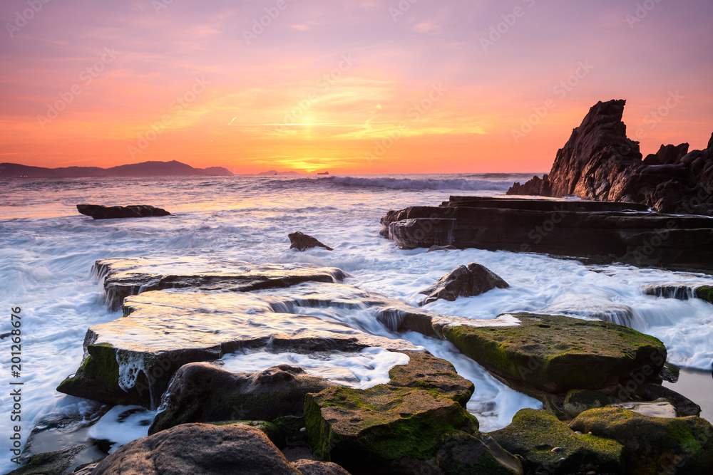 amazing sunset landscape at rocky beach