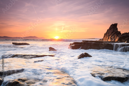 amazing sunset landscape at rocky beach