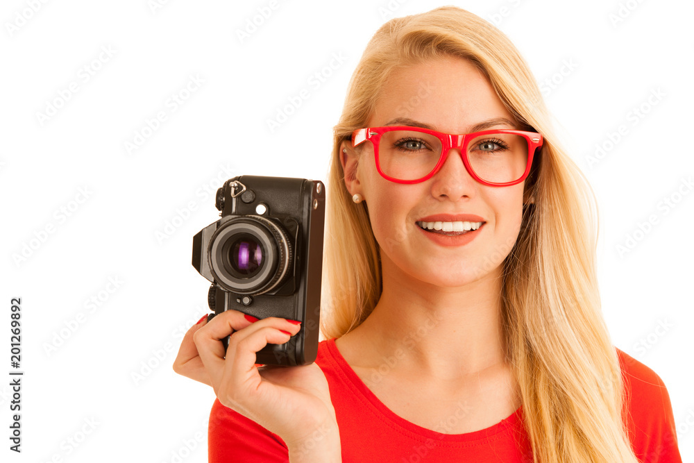 Woman in red with a retro camera isolated over white background Woman in red with a retro camera isolated over white background