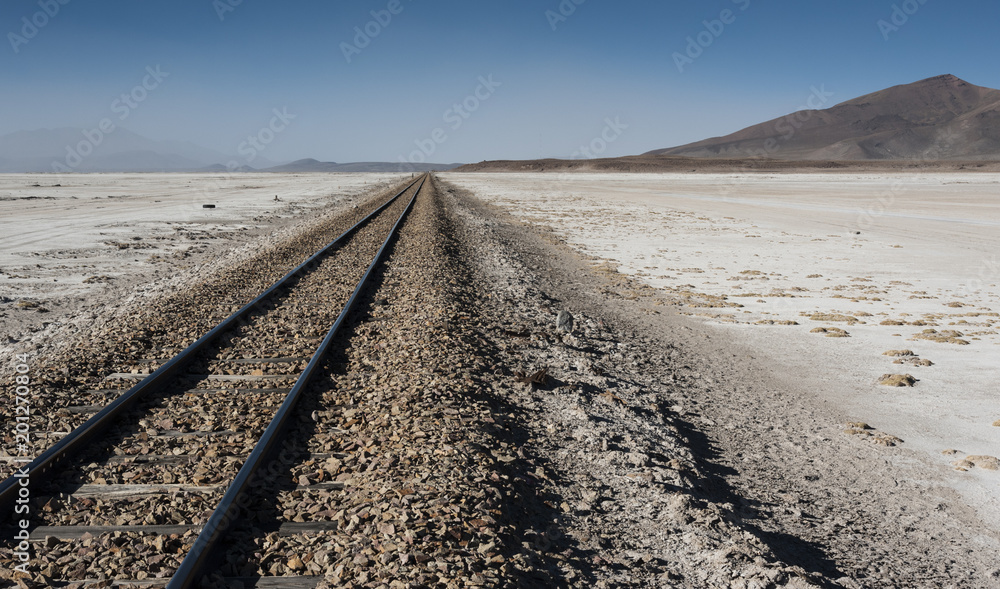 Railroad tracks across Salar de Chiguana in Sud Lipez Altiplano - The Ferrocarril de Antofagasta - Bolivia, South America