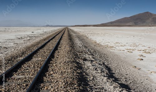 Railroad tracks across Salar de Chiguana in Sud Lipez Altiplano - The Ferrocarril de Antofagasta - Bolivia, South America