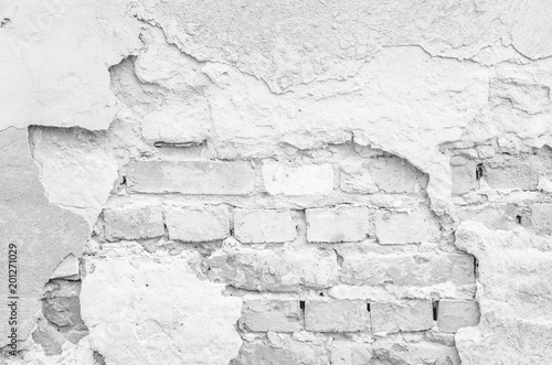 Texture of a white ruined brick wall