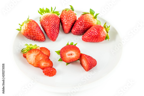strawberries in white porcelain dish with white background