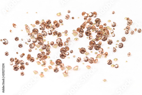 Many scattered rhinestones. On a white background