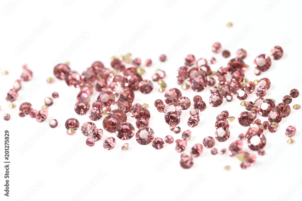 Many scattered rhinestones. On a white background Many scattered rhinestones. On a white background