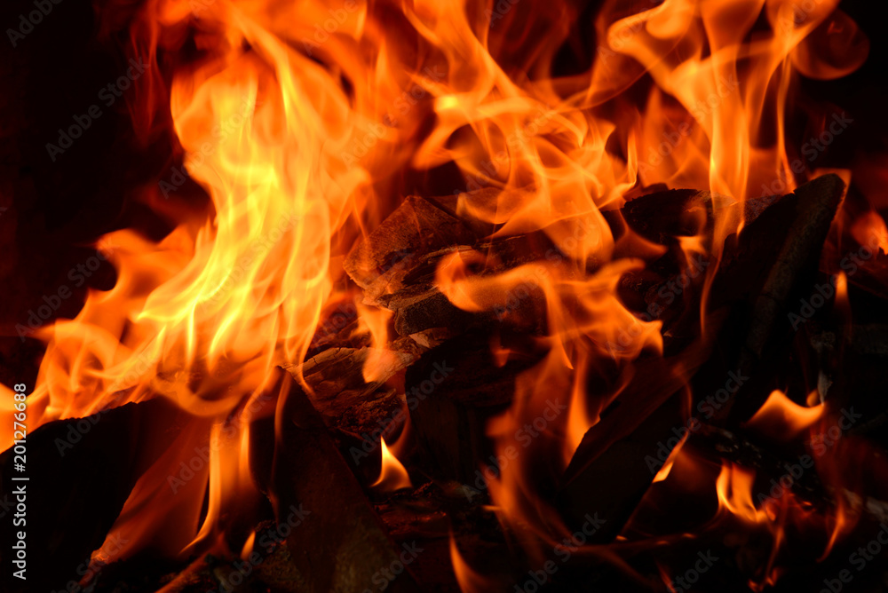 Closeup of fire flame and wood burning in fireplace. Closeup of fire flame and wood burning in fireplace.