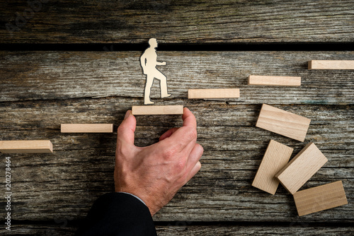 Canvastavla Teamwork concept with businessman holding up stairs