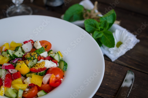 Vegetables salad on a white plate