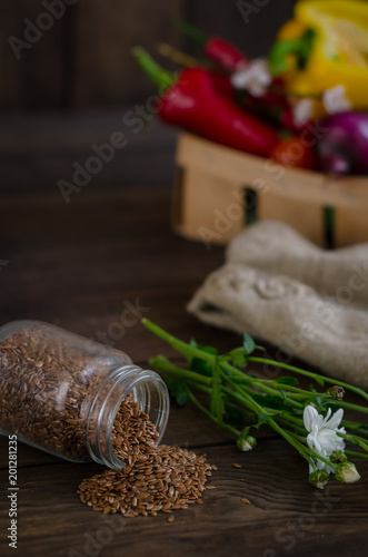 Flax seeds on a dark wooden background