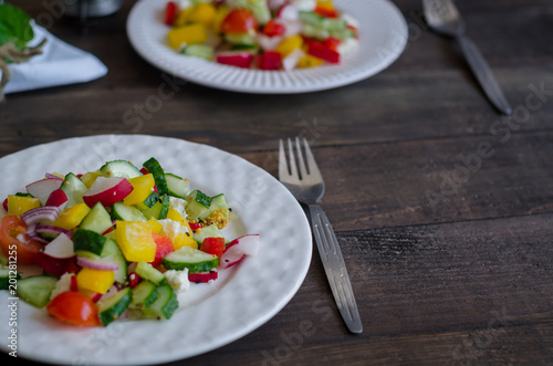 Vegetables salad on a white plate