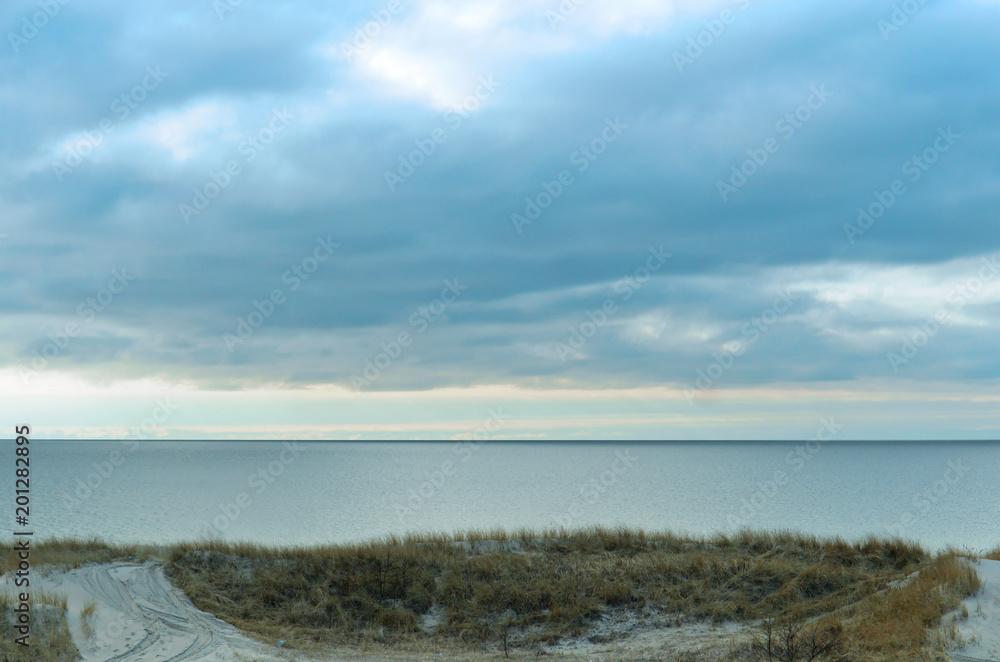 Beach sea. Sea coast with its sandy dune and yellow grass is the Baltic sea.