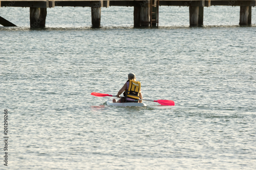 Kayacker rests paddles