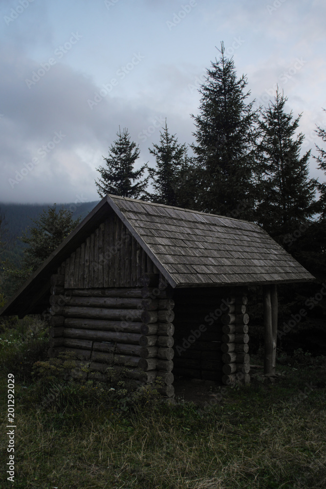 simple wooden cabin used as a hiking shelter, czech republic simple wooden cabin used as a hiking shelter, czech republic