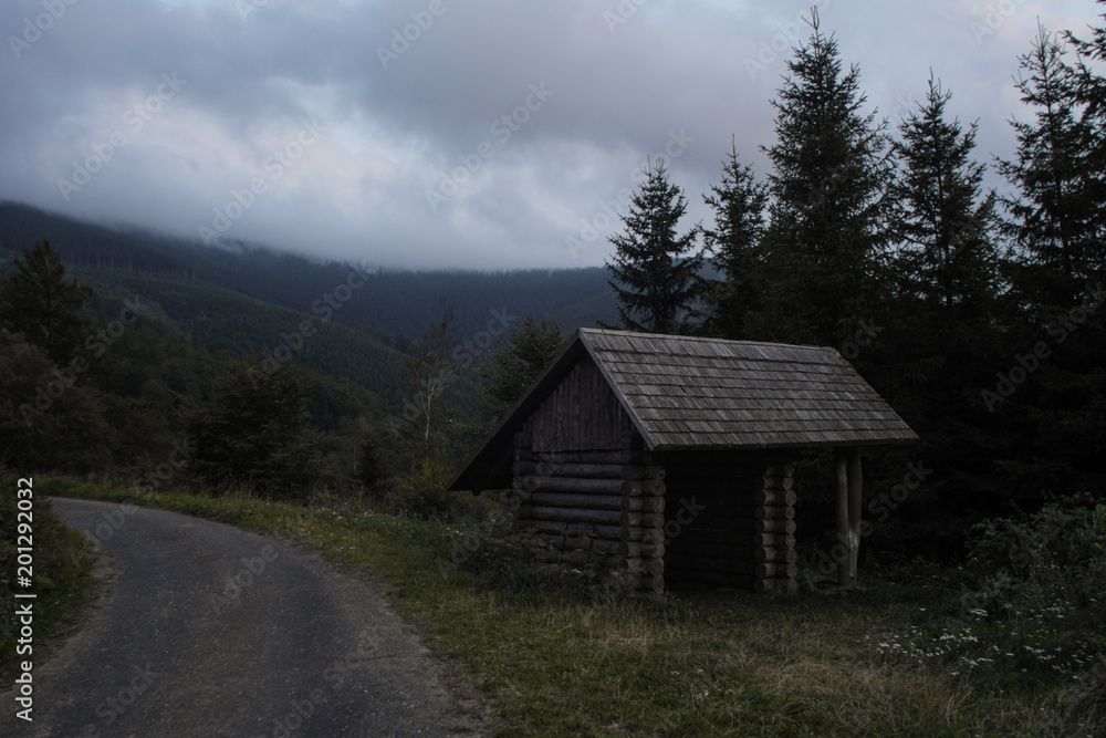 simple wooden cabin used as a hiking shelter, czech republic