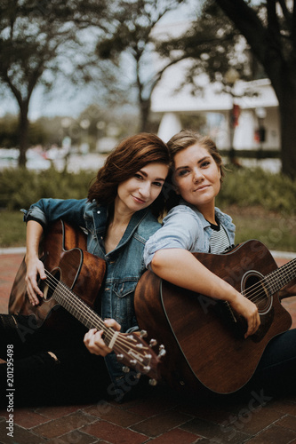 Cute Attractive Female Musician Friends Smiling and Modeling photo