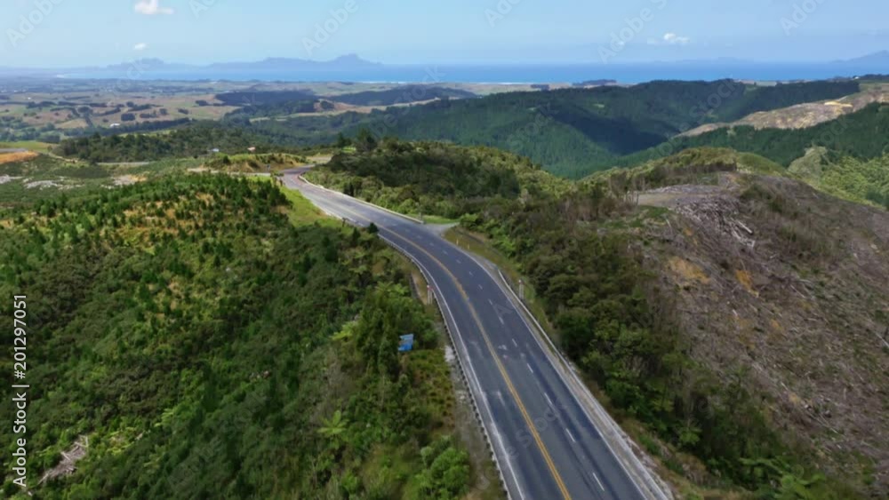 Empty road surrounded by green hills, New Zealand Empty road surrounded by green hills, New Zealand