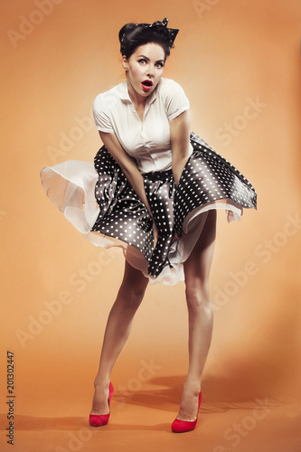 Wallpaper Mural wind suddenly lifted the girl's skirt in pin-up style Torontodigital.ca