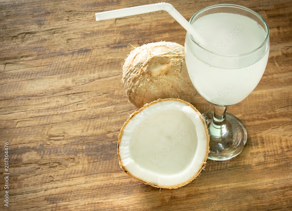 coconut juice and coconut on wooden background with space for your text or letter coconut juice and coconut on wooden background with space for your text or letter