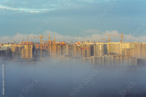 fog in city on construction site