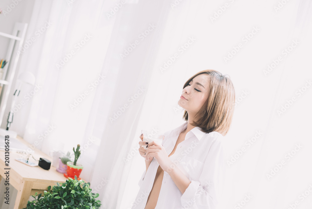 Portrait of the beautiful woman drinking tea in the morning Portrait of the beautiful woman drinking tea in the morning