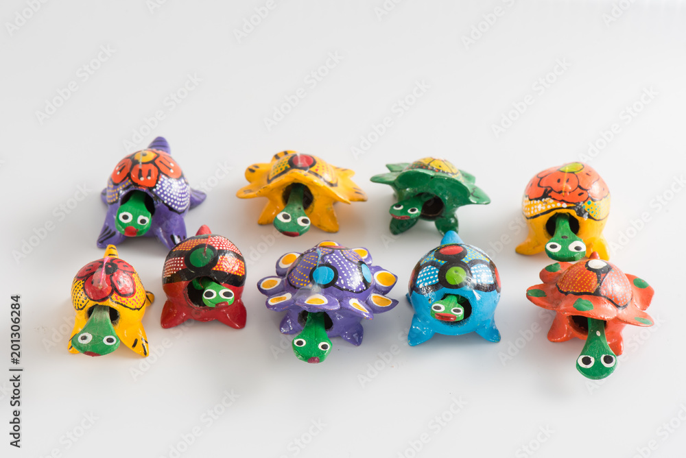 Colorful little wooden turtles bought from various street vendors in the Dominican Republic with copy space