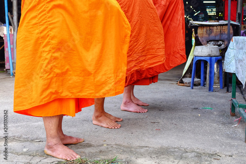 The orange tones of monk costumes in Buddhism,Buddhist monks are blessing
